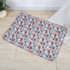 A rectangular washable pet training mat for dogs featuring a pattern of various dog breeds and elements.