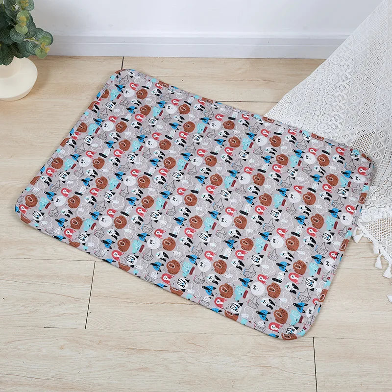 A rectangular washable pet training mat for dogs featuring a pattern of various dog breeds and elements.