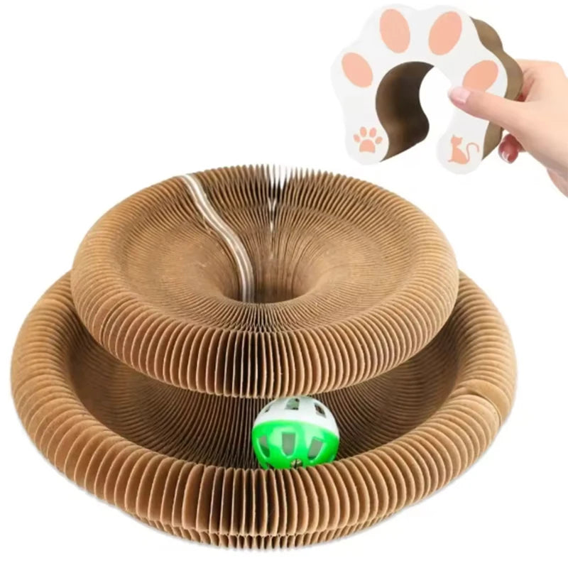 A brown accordion scratching board with a green ball and a paw print shape shown next to a hand.