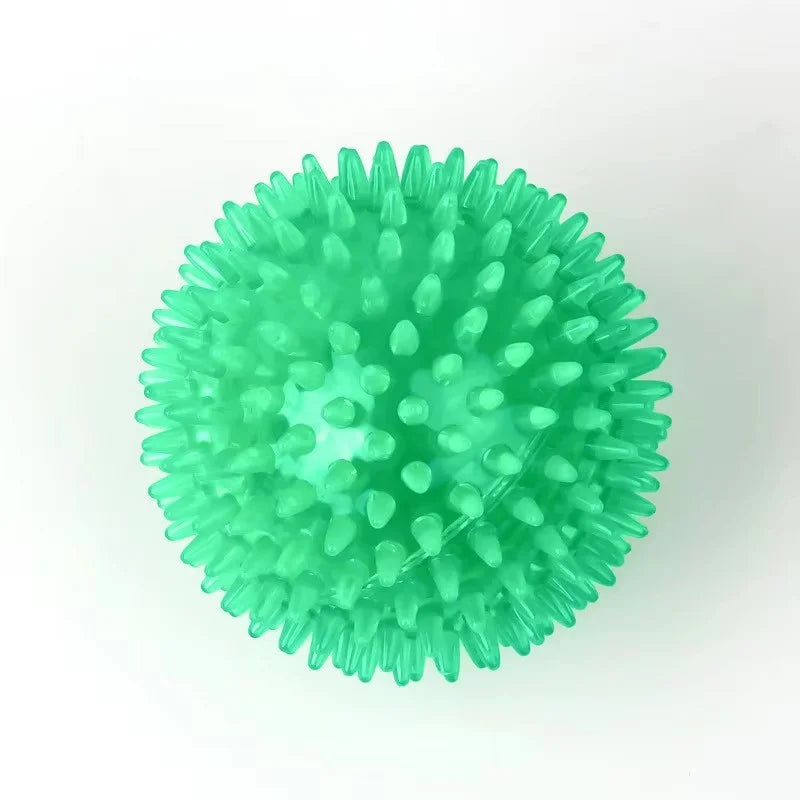 A bright green spiky squeaky dog toy ball for interactive play and dental health.