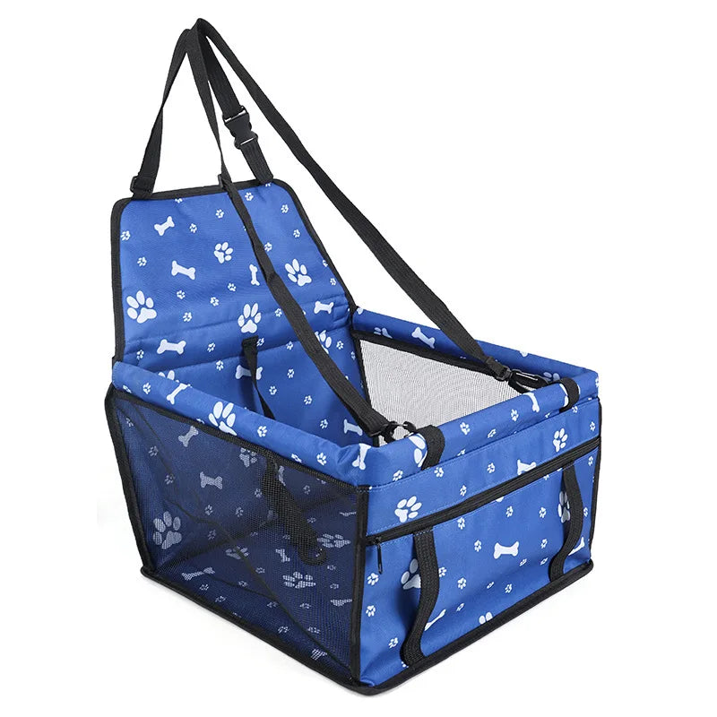 A blue pet travel booster seat with a safety belt for dogs and cats, featuring a mesh enclosure.