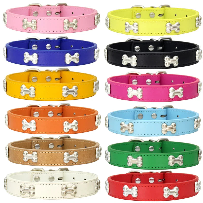 A collection of various colored leather dog collars displayed against a white background.