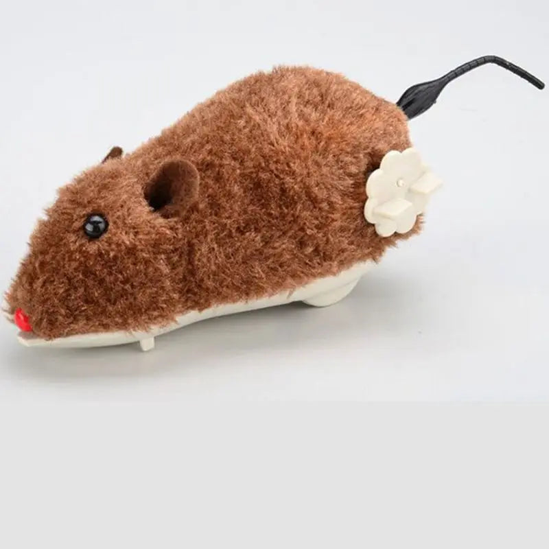 Ratón de peluche mecánico marrón con orejas negras y detalle de flor blanca.