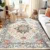 A detailed view of a blue and cream bohemian Persian floral area rug in a living room setting.