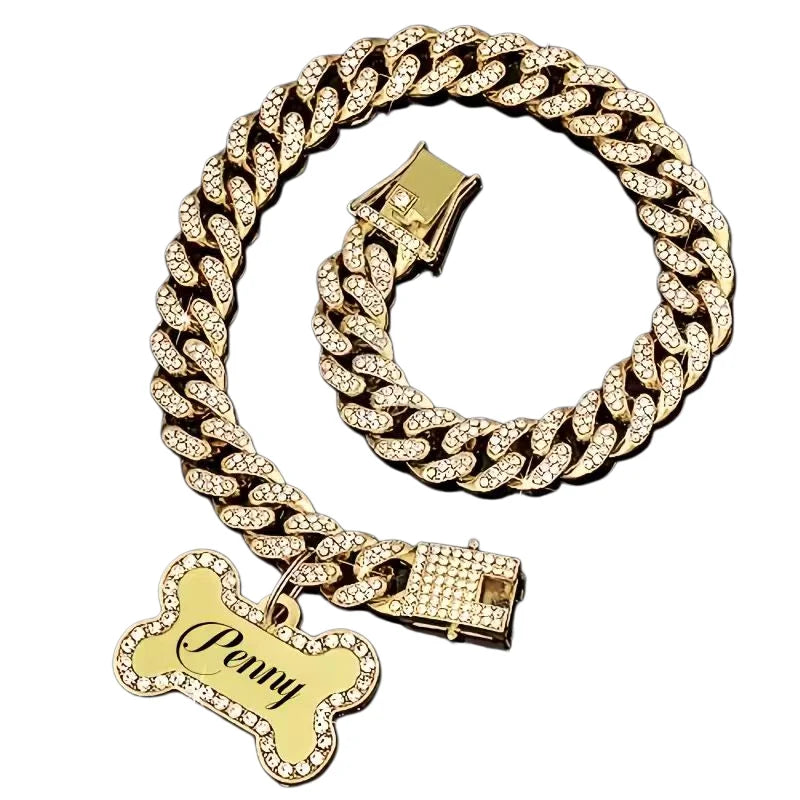 Gold-toned Cuban link chain necklace with rhinestones and a bone charm pendant