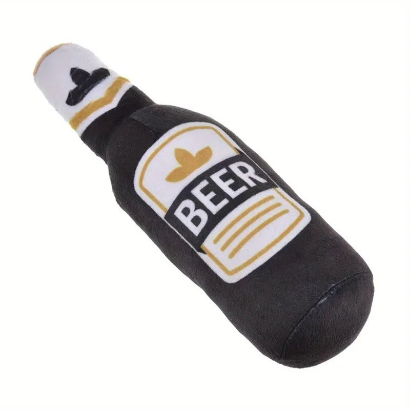 A black squeeze toy shaped like a beer bottle with a white label and a black pom-pom on top.
