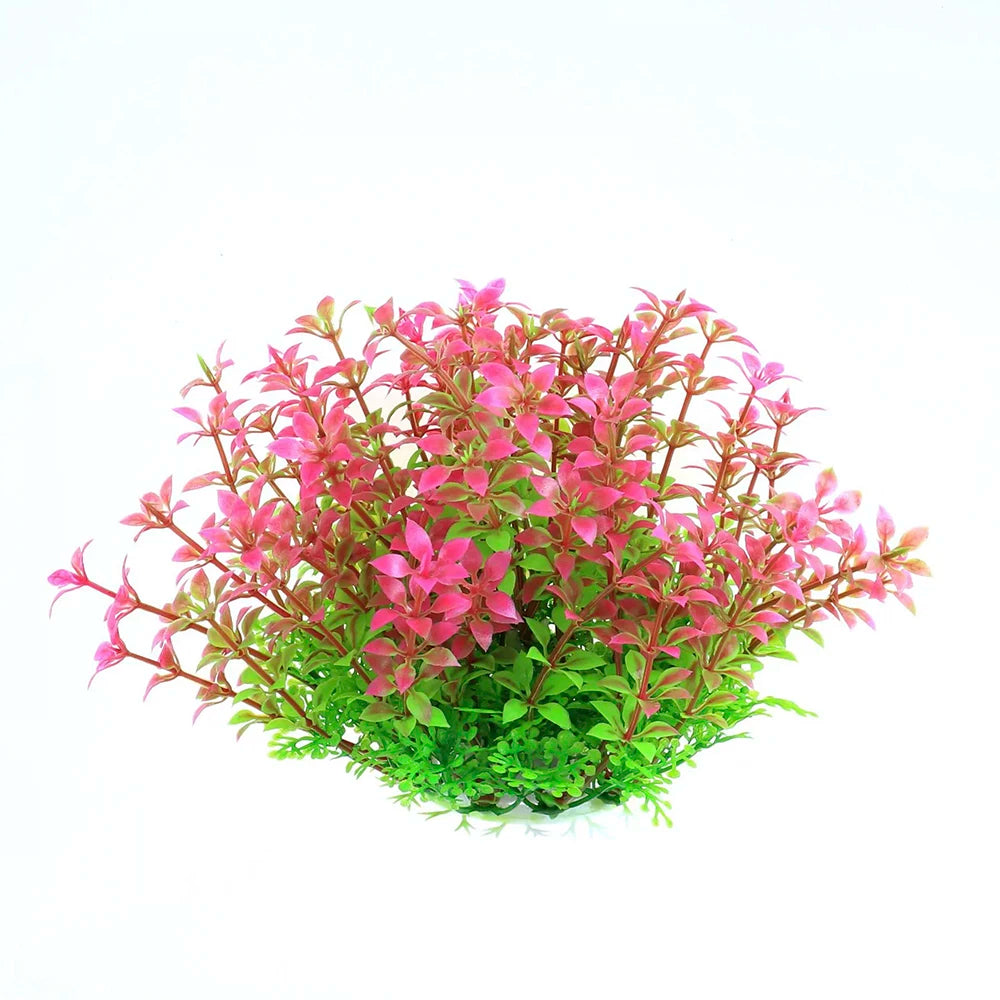 Un amas de plantes aquatiques artificielles aux feuillages rose et vert pour décorer un aquarium.