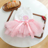 A pink and white elegant dog birthday suit for a puppy featuring a floral design and tulle skirt.