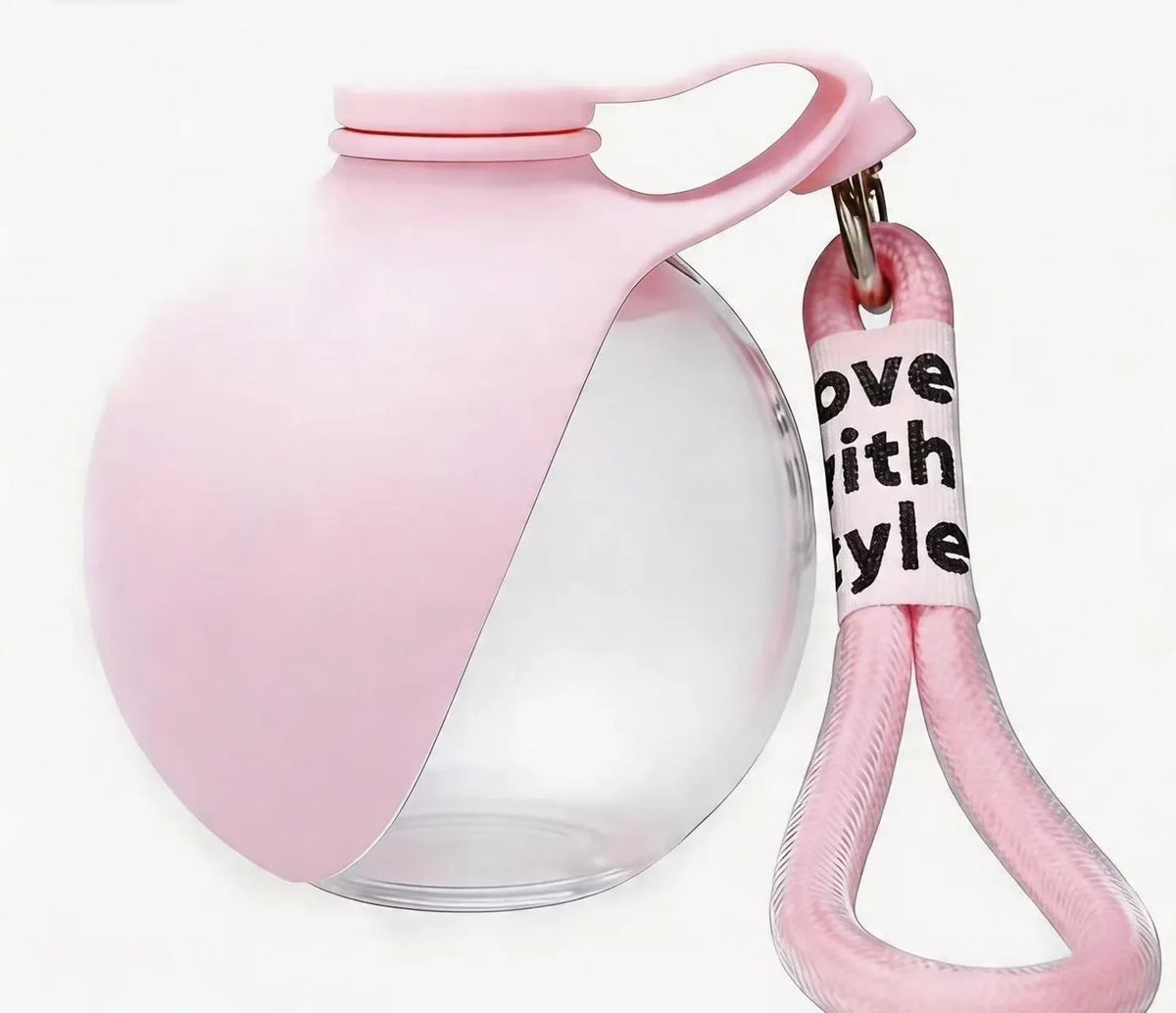 A pink portable dog water bottle with a leakproof design and a carabiner clip attached to the lid.