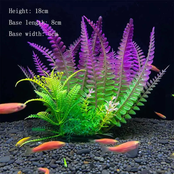 A vibrant artificial aquatic plant featuring purple and green foliage growing in a dark gravel substrate.