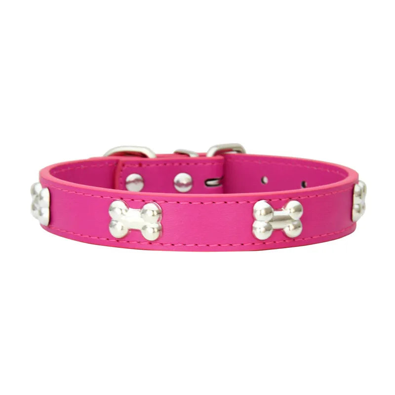 A bright pink leather dog collar with silver hardware and a woven pattern.