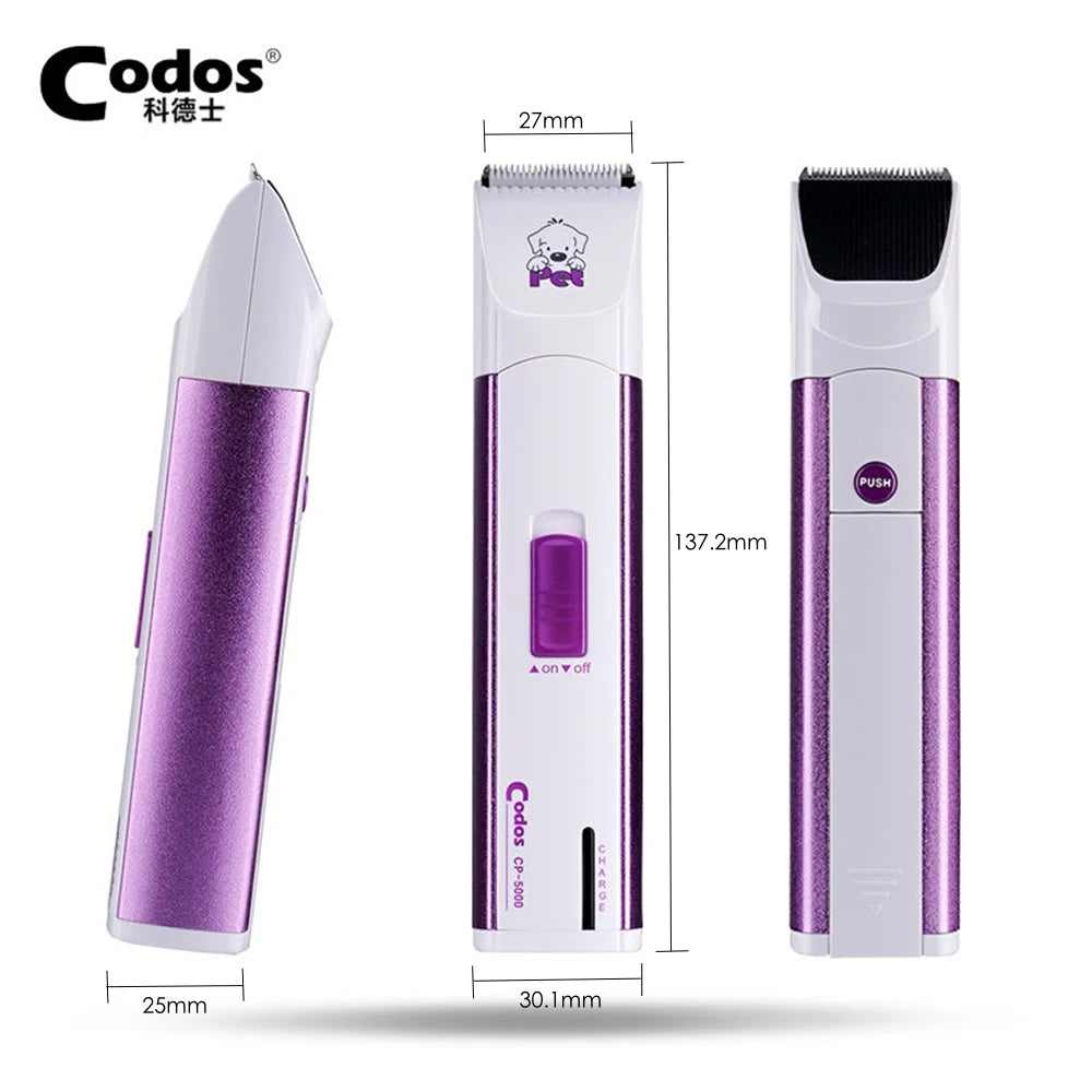 A purple electric pet grooming clipper with a black brush and silver body is shown in a vertical view.