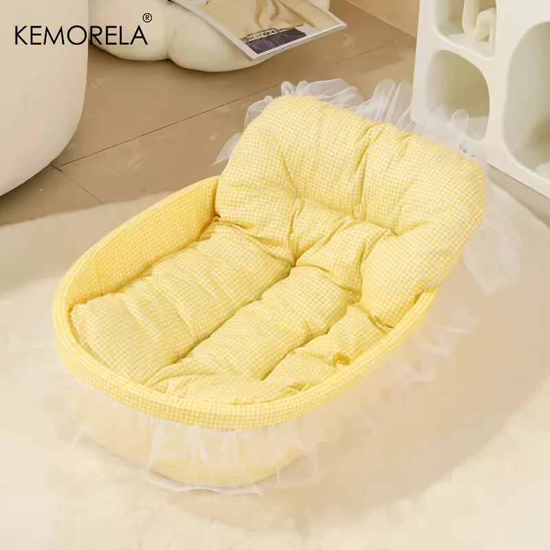 A yellow quilted pet bed mat with a gauze trim is displayed on a white surface.