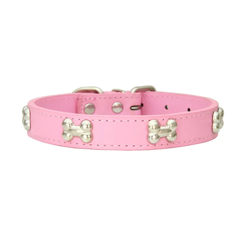 A pink leather dog collar with silver hardware and a buckle.