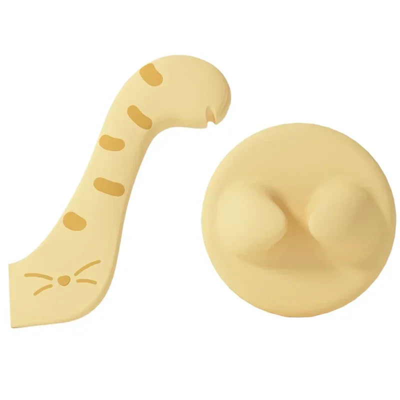 A light yellow multifunctional pet feeding spoon with a cat-shaped end and a round sealing lid.