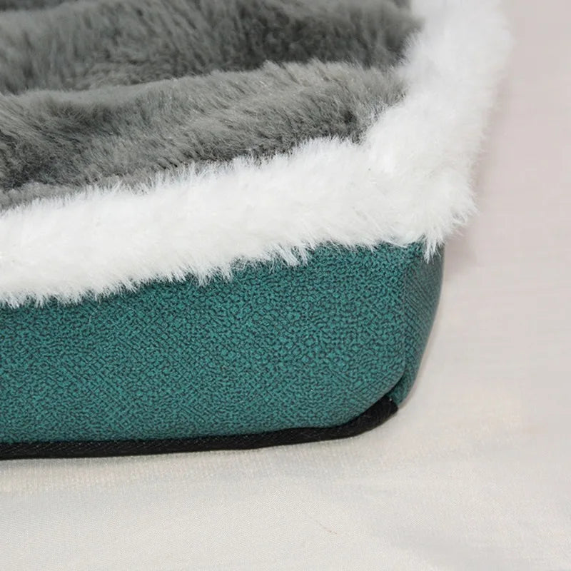 A cozy fleece dog bed featuring gray and white faux fur trim on a teal fabric base.