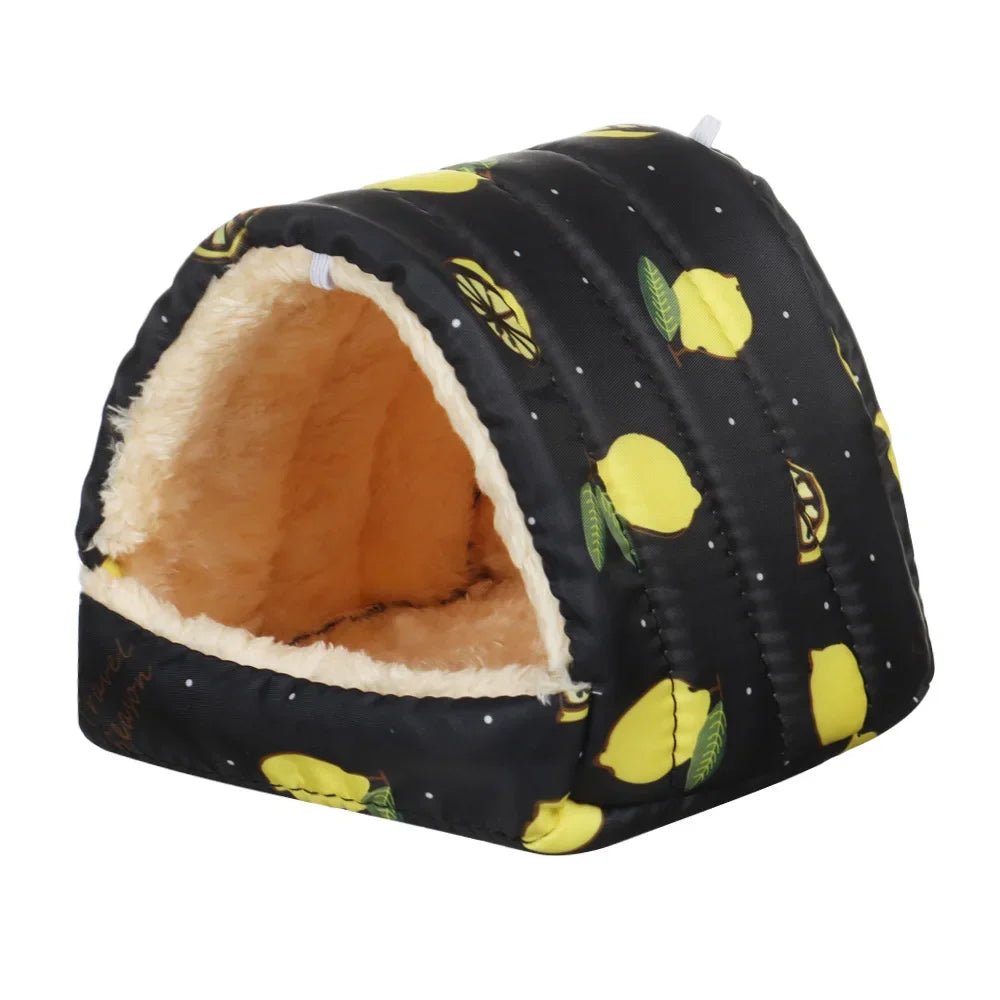 A black fabric pet nest bed with a yellow citrus print and a light brown fluffy lining.