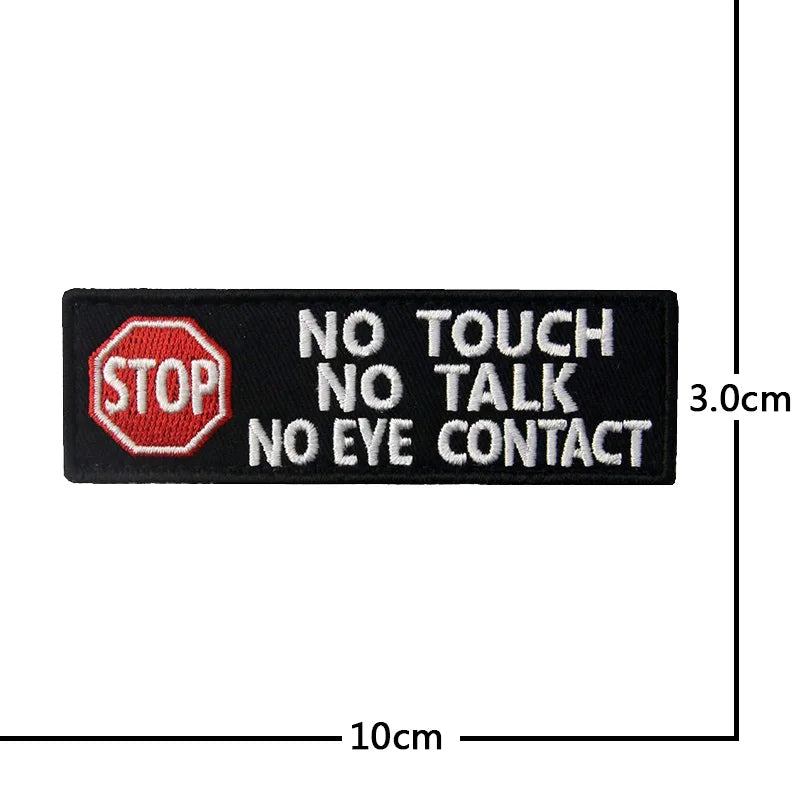 Black embroidered patch with red STOP sign and text NO TOUCH NO TALK NO EYE CONTACT