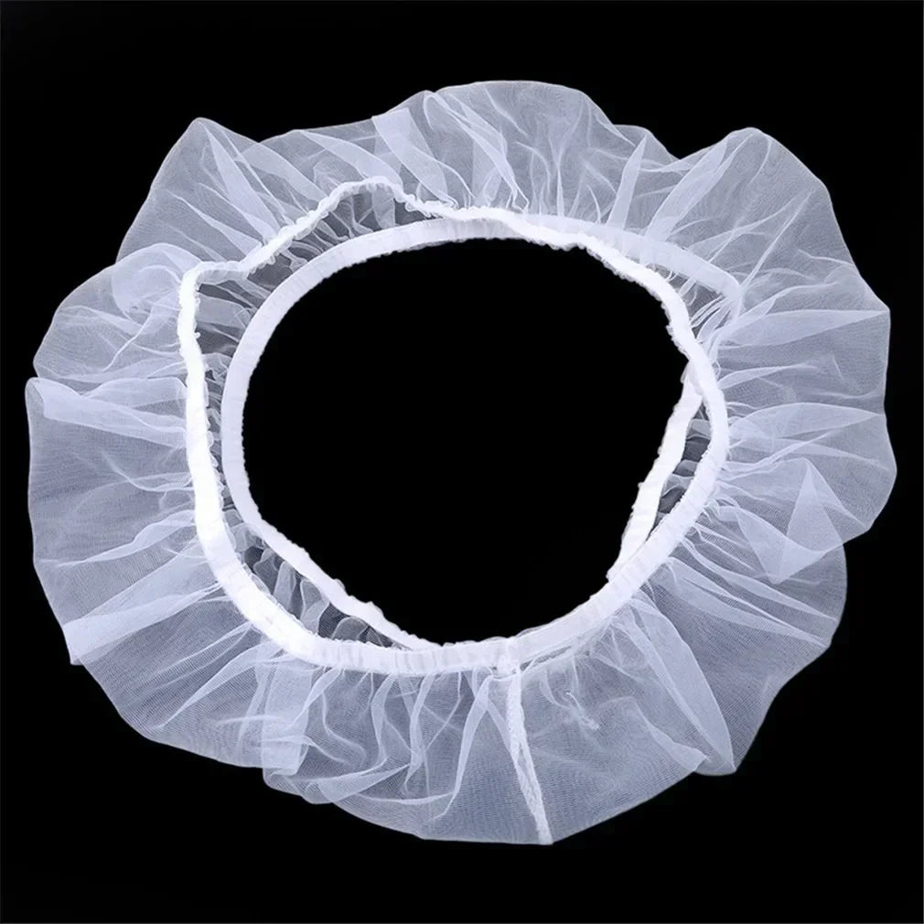 A white breathable mesh bird cage cover with a ruffled edge shown against a black background.