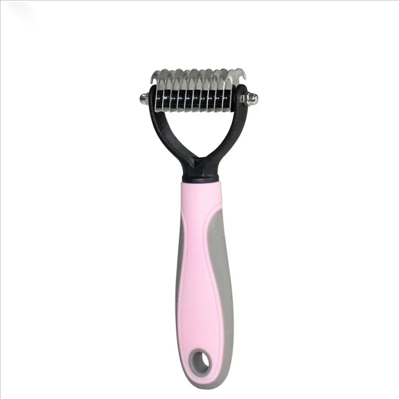 A pink and gray stainless steel pet hair removal comb brush for dogs and cats.