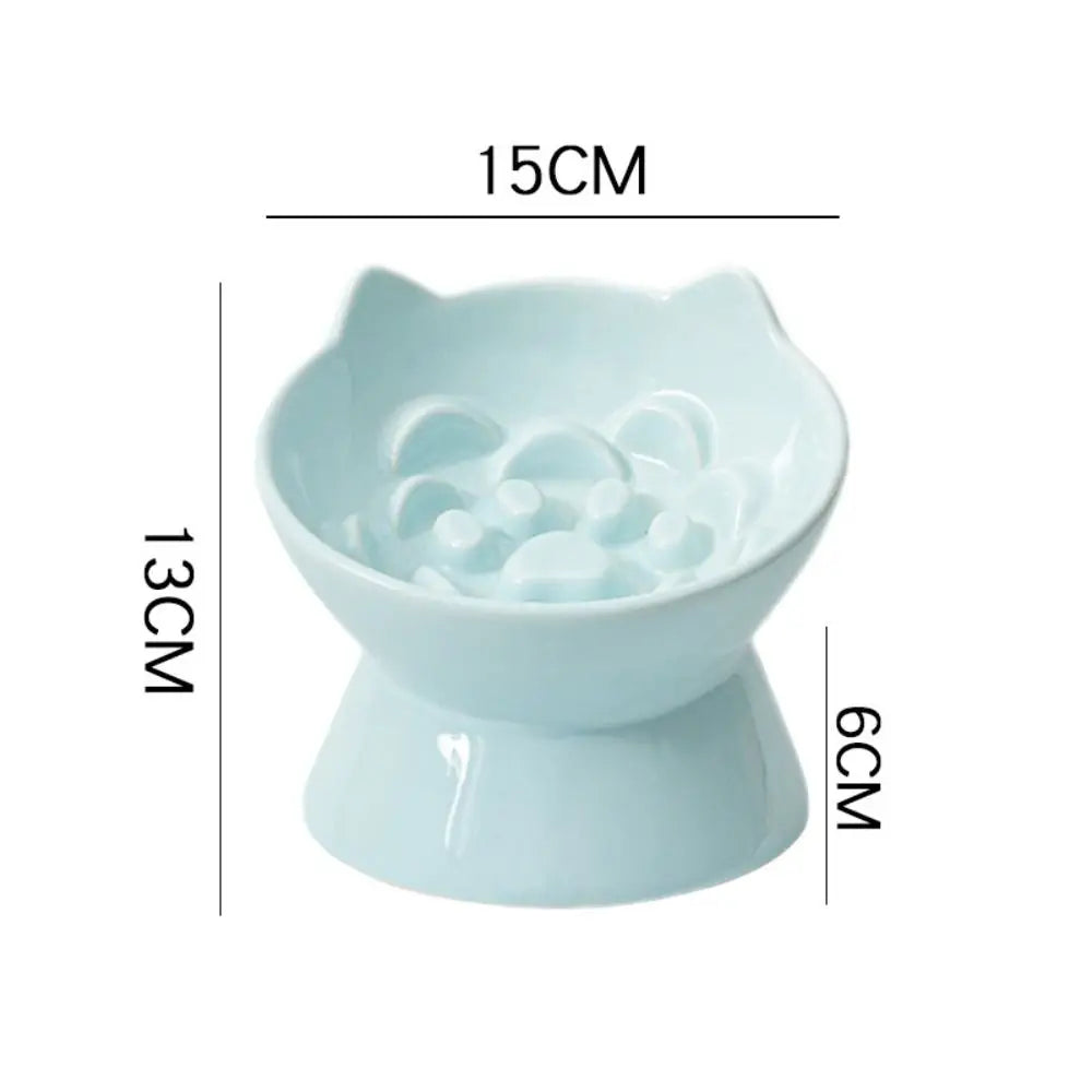 Light blue ceramic pet food bowl with a raised slanted design