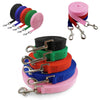 A collection of colorful nylon dog leashes in various colors and lengths, including pink, red, green, blue, and black.