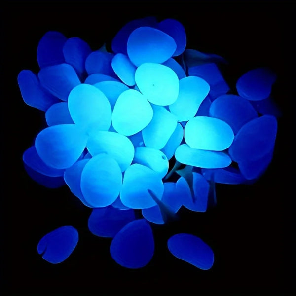 A cluster of bright blue glow-in-the-dark decorative stones used for planters or vases against a black background.