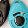 A bright blue pet training clicker with a black silicone body and silver hardware.