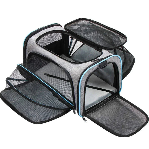 Gray expandable pet carrier backpack with a mesh top and reflective trim