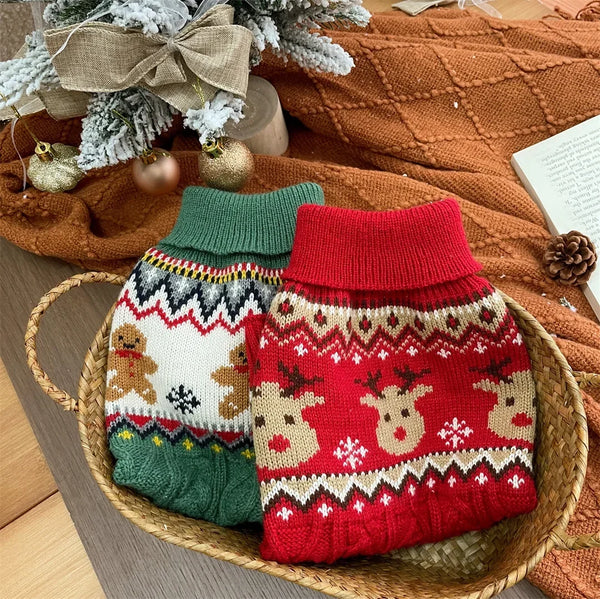 A knitted pet sweater for dogs and cats in red and green colors resting in a woven basket.
