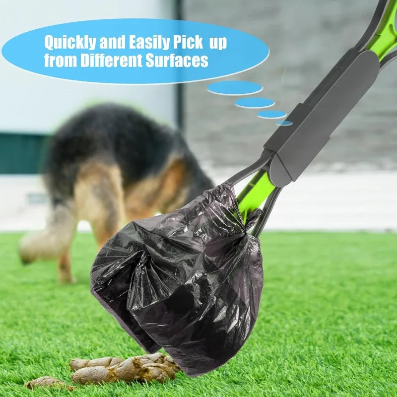 A black pet poop scooper with a long handle is shown picking up dog waste on green grass.