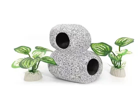 Two cylindrical gray plastic plants with green leaves and secure bases for aquarium landscaping
