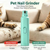 A teal electric pet nail grinder is shown next to a cat grooming its claws on a sofa.