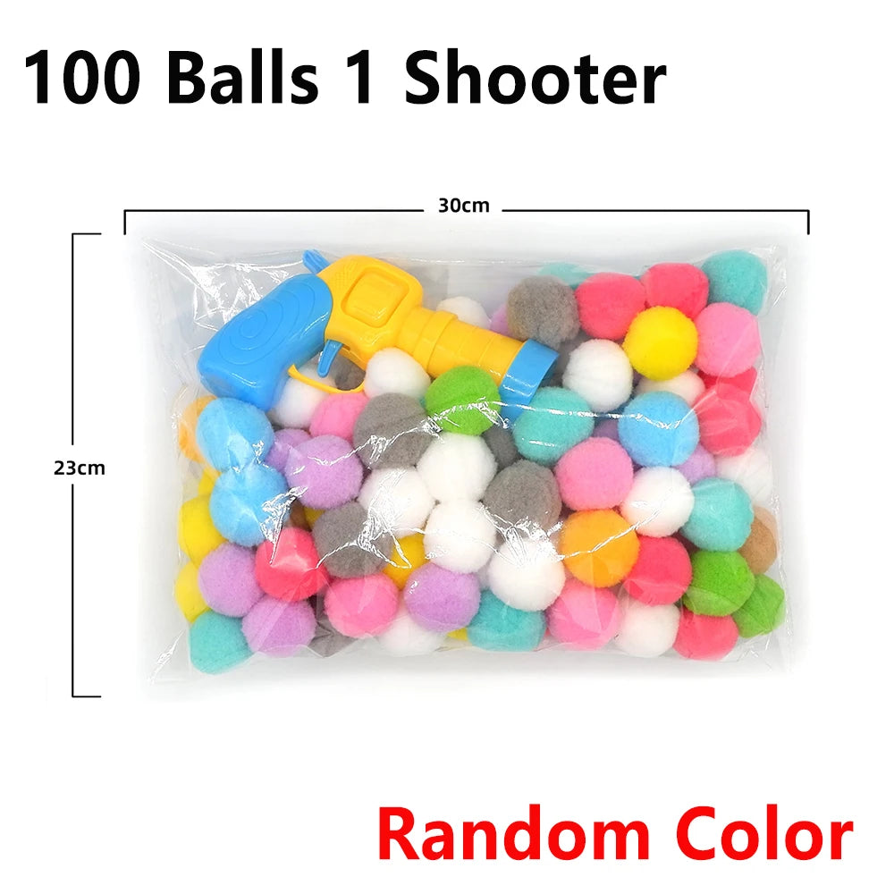 A clear plastic bag filled with 100 soft plush balls of random colors and a yellow shooter toy gun.