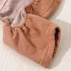 A close-up of a tan dog denim jumpsuit costume for small to medium breeds.