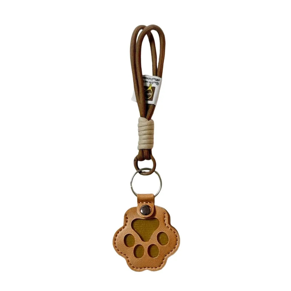 Brown refillable pet hair keychain with a cat paw charm