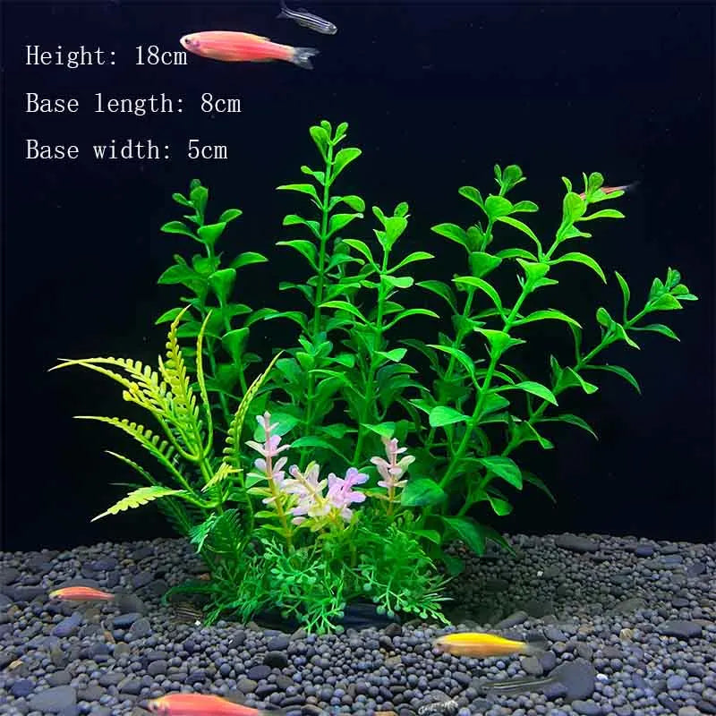 A vibrant artificial aquatic plant featuring green foliage and pink flowers planted in dark gravel.