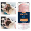 A glass jar of YCHZ Plant Extract Paw Balm with a pink lid and a paw print design.