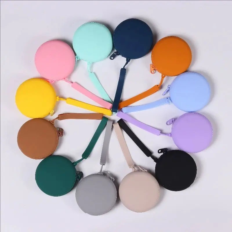 A collection of colorful silicone pet treat pouches in various shades including pink, yellow, blue, and purple.