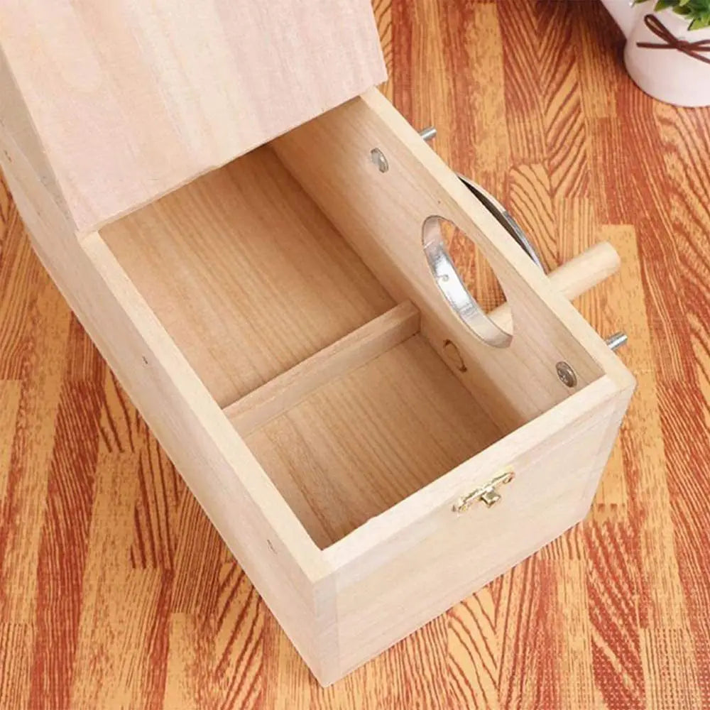 A light wood bird nesting box with a hinged lid showing the interior compartment.