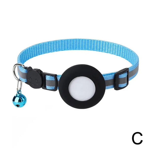 A blue and gray reflective cat collar with a black circular tag and silver charm.