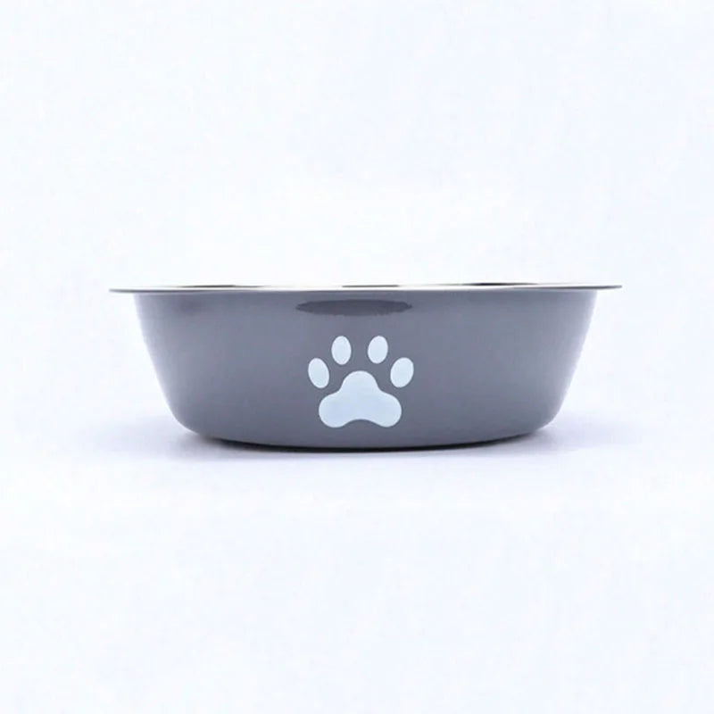 A gray stainless steel pet bowl with a white paw print design.