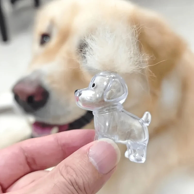 A clear plastic dog hair keepsake pendant is being held by a hand against the blurred background of a golden retriever.