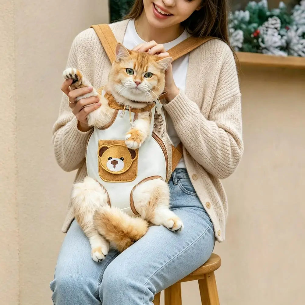 A woman is holding a fluffy orange tabby cat in a breathable carrier backpack with a safety leash.