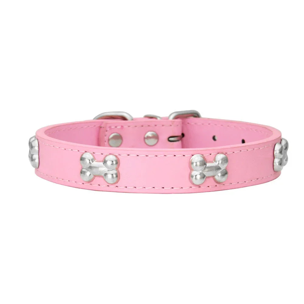 Pink padded leather dog collar with silver bone rivets and a buckle.