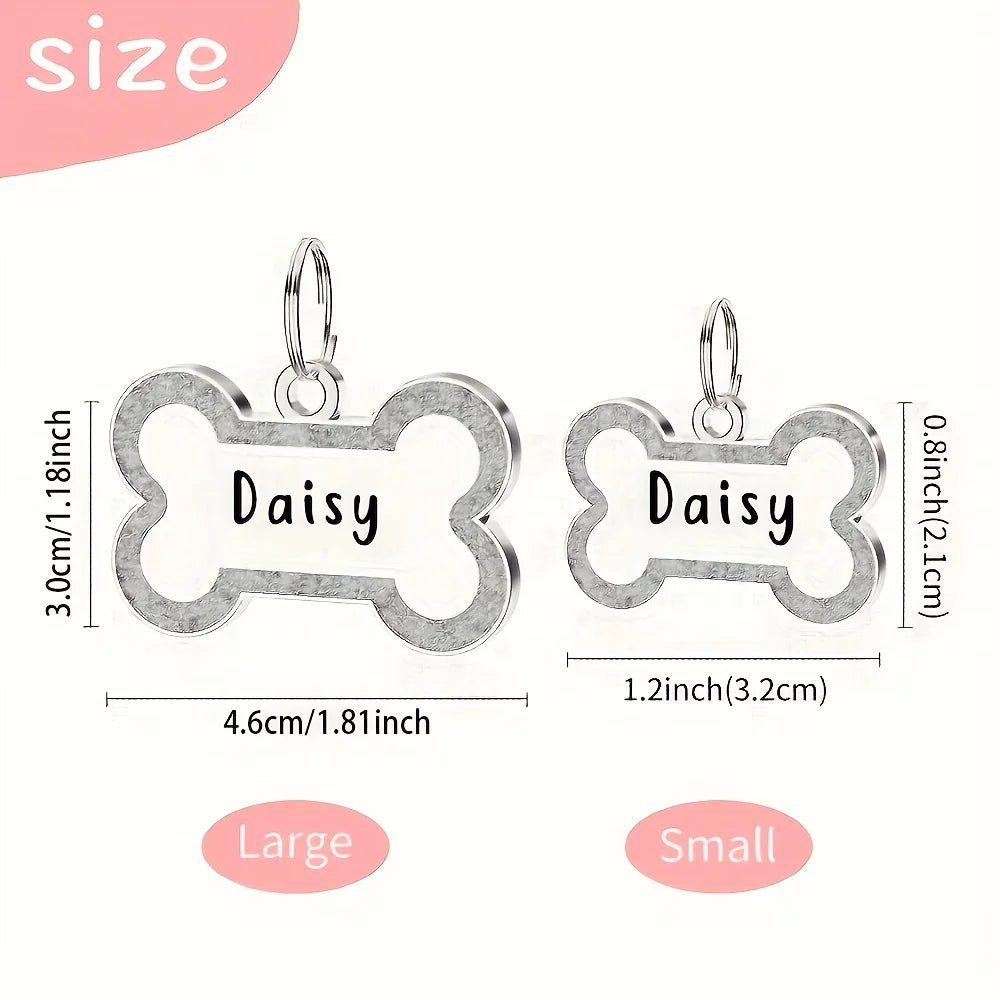Two silver engraved bone-shaped pet ID tags, labeled Large and Small sizes.