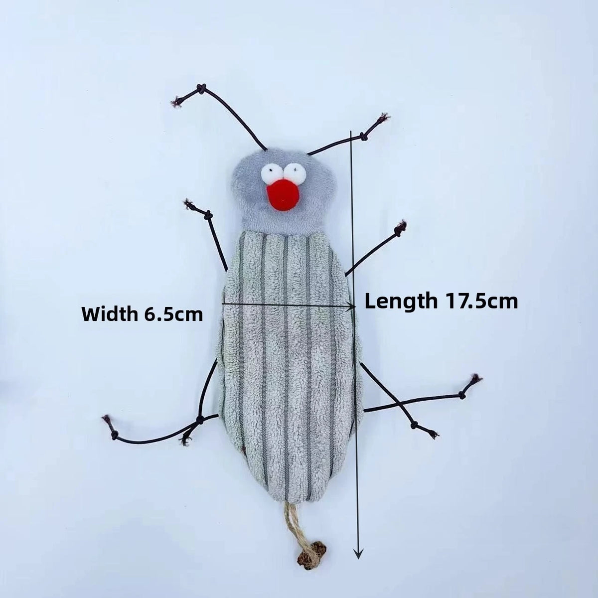 A plush toy resembling a cockroach with cat features, gray body, red mouth, and antennae.