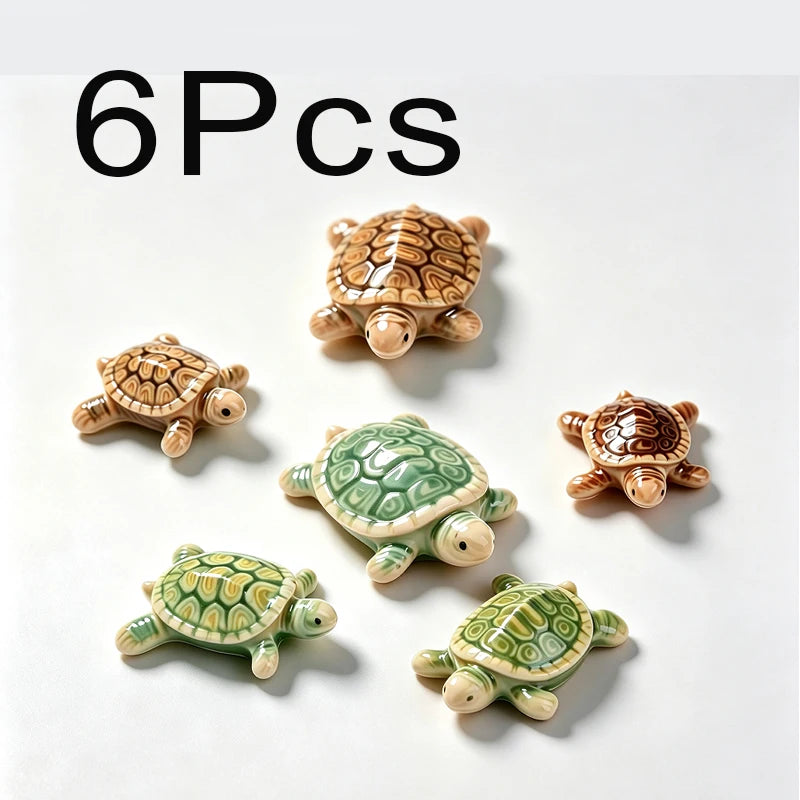 Six small ceramic turtle floating ornaments in various shades of green and brown.