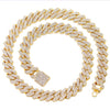A gold iced out Cuban link chain necklace featuring rhombus diamond accents.