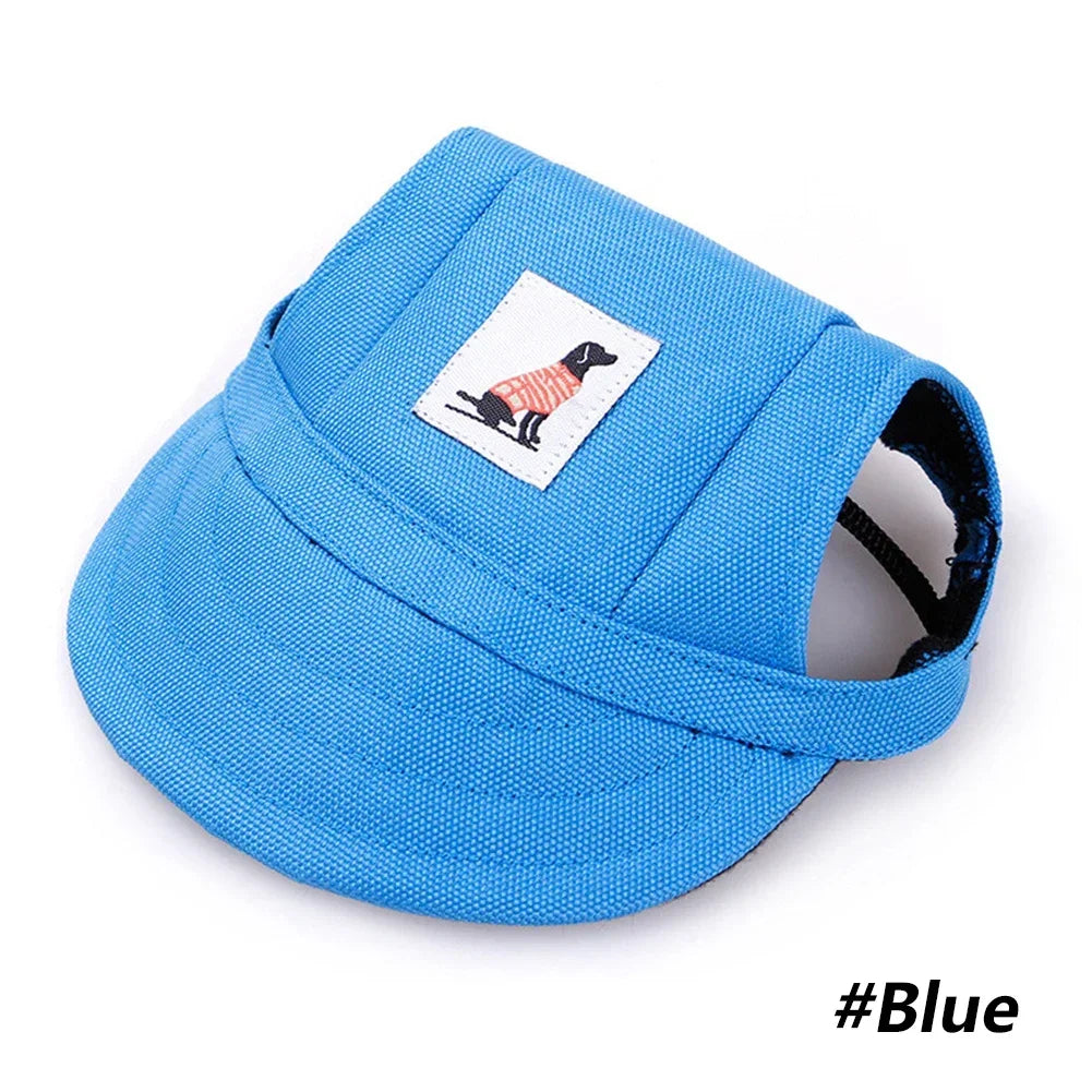 A bright blue pet grooming visor cap featuring a silhouette of a dog on the front.